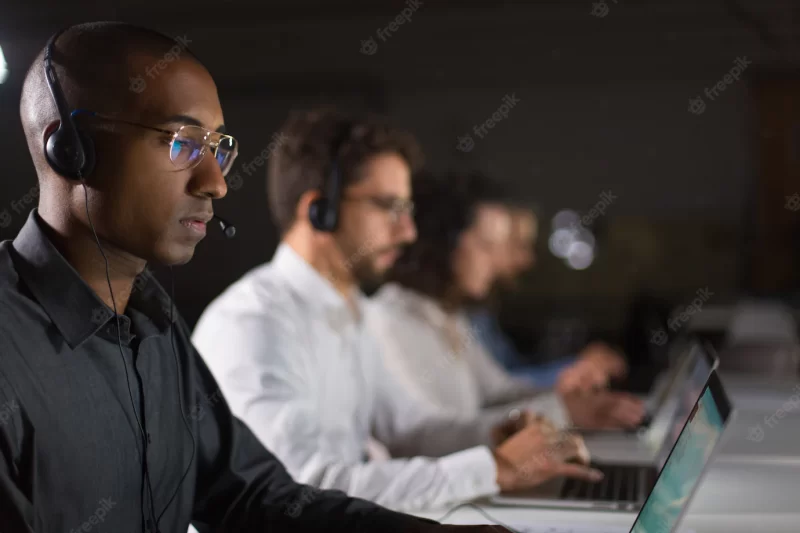 Concentrated african American call center operator working Free Photo