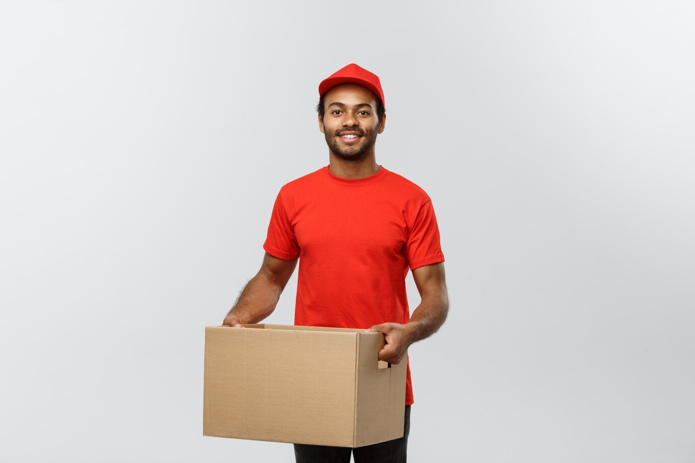 Delivery Concept Portrait Happy African American Delivery Man Red Cloth Holding Box Package Isolated Grey Studio Background Copy Space 1258 1197