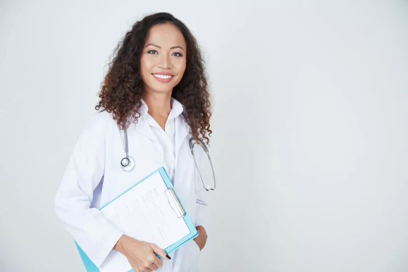 Doctor standing with health card Free Photo Doctor standing with health card Free Photo