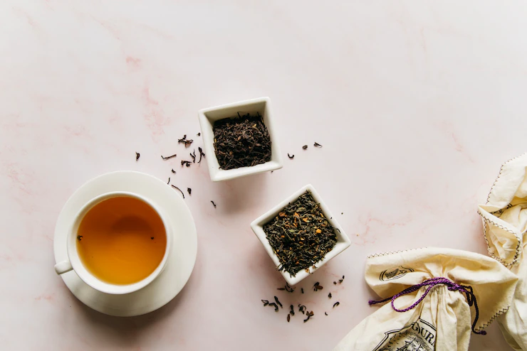 Dried Tea Herbs Bowl With Black Tea Marble Texture Backdrop 23 2148186316