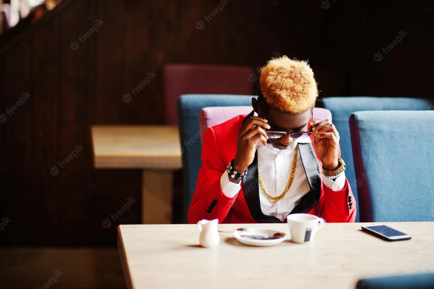 Fashion African American Man Model Red Suit With Highlights Hair Sunglasses Sitting Cafe With Coffee Speaking Mobile Phone 627829 1954