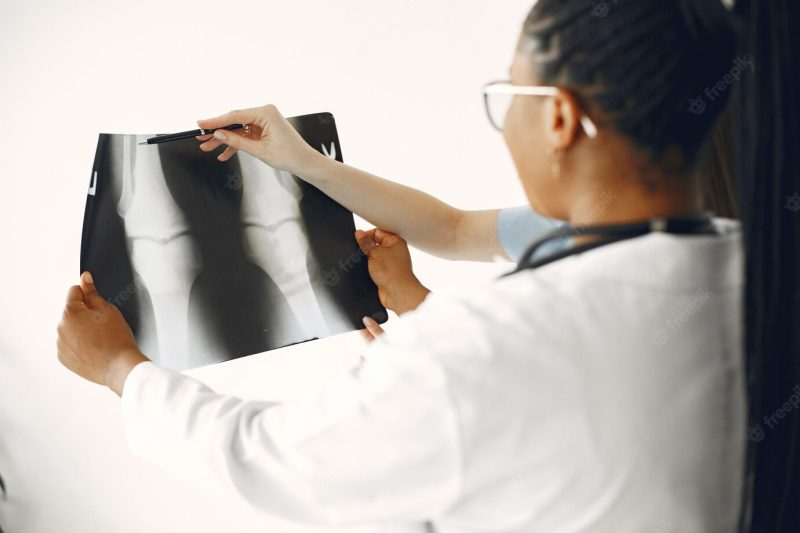 Female doctors in bathrobes. African girl. stethoscope on doctor’s neck. Free Photo