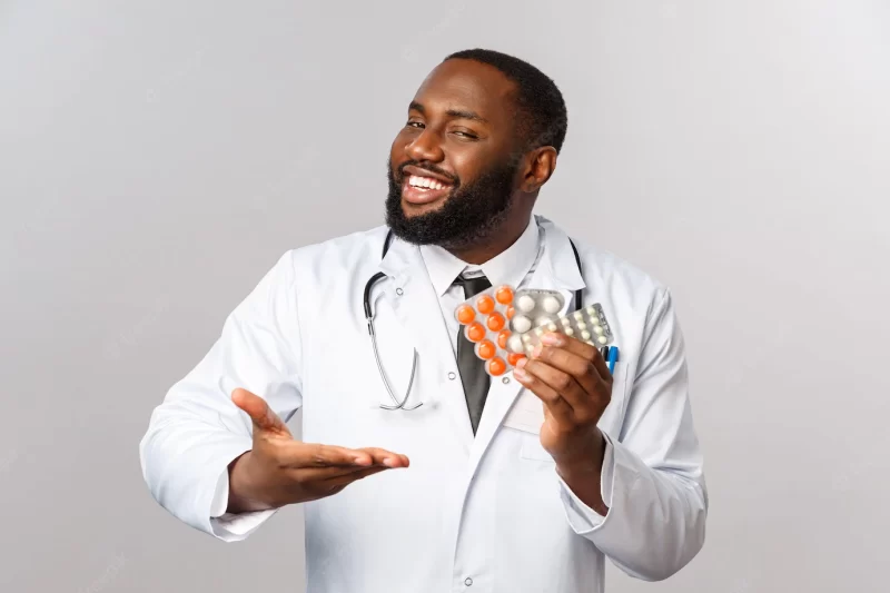 Flu, disease, healthcare and medicine concept. happy african-american male doctor in white coat present new drugs, cure from disease or viruses, showing pills guarantee good quality of treatment Free Photo Flu, disease, healthcare and medicine concept. happy african-american male doctor in white coat present new drugs, cure from disease or viruses, showing pills guarantee good quality of treatment Free Photo