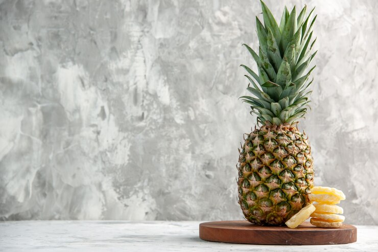 Front View Whole Fresh Golden Pineapple Limes Cutting Board Standing Marble Surface 140725 97211