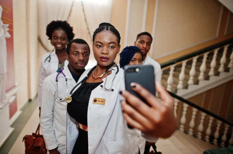 Group of african doctors students inside medical university making selfie at phone Free Photo