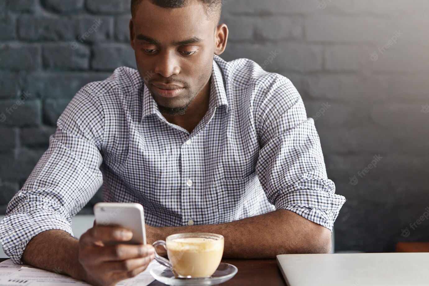 Handsome African Office Worker Wearing Checkered Shirt With Rolled Up Sleeves Enjoying Online Communication 273609 9112