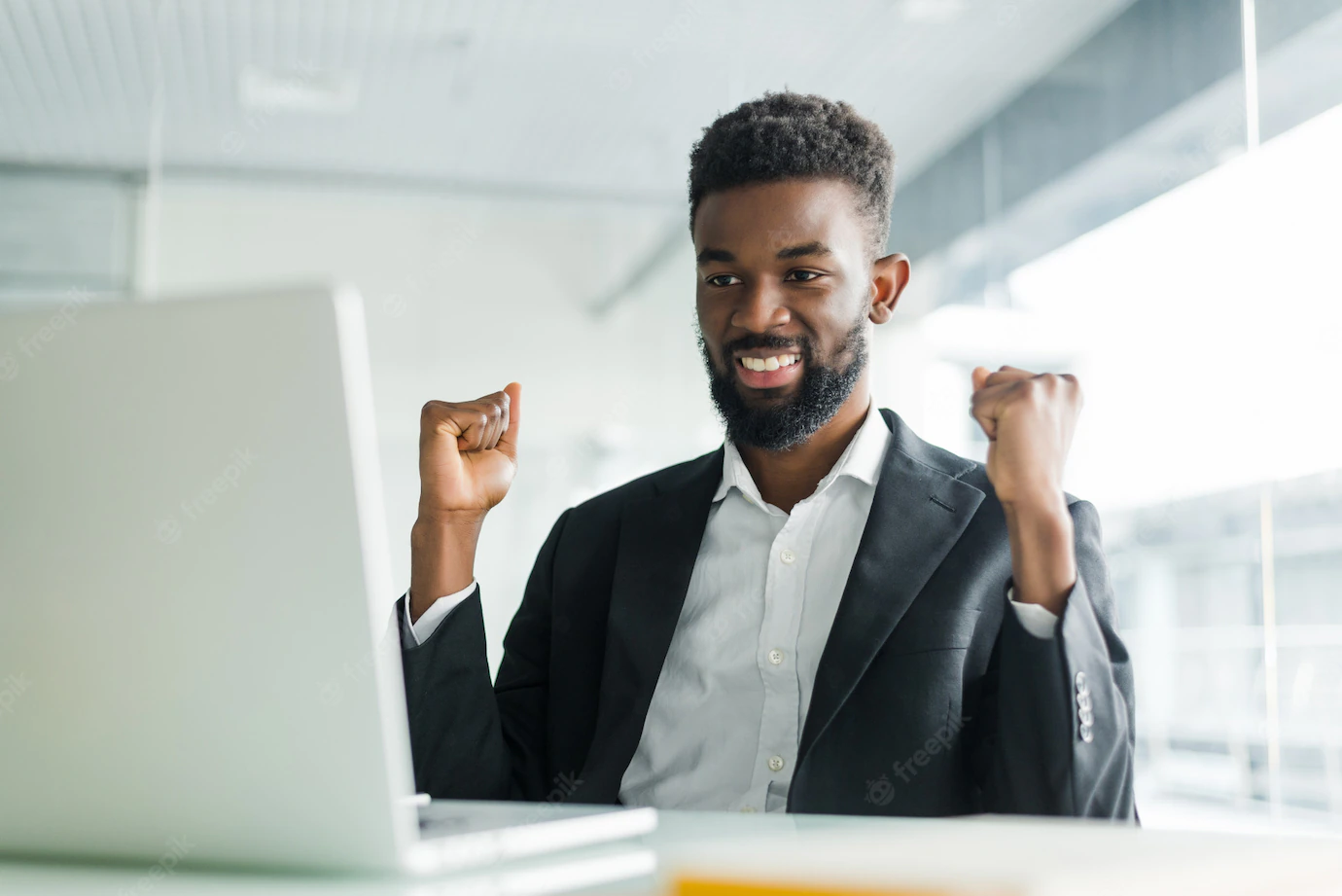 Happy African American Businessman Suit Looking Laptop Excited By Good News Online Black Man Winner Sitting Office Desk Achieved Goal Raising Hands Celebrating Business Success Win Result 231208 673