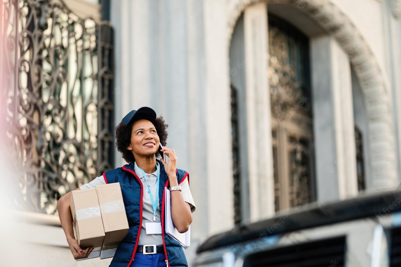 Happy African American Delivery Woman Carrying Packages Talking Mobile Phone Street 637285 2070