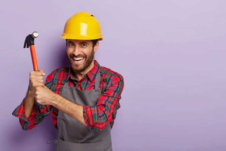 Happy Builder Wears Construction Helmet Does Repairing With Hammer 273609 27501