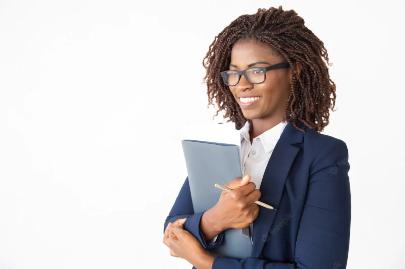 Happy cheerful office assistant in glasses holding documents Free Photo