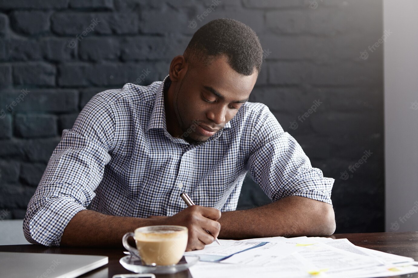 Hardworking Young African Office Worker Handwriting Filling Papers While Doing Accounting 273609 9135