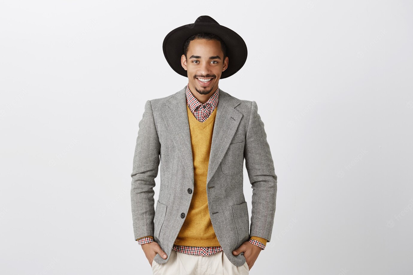 He Knows How Make Great Deals Portrait Self Assured Handsome Male Model With Dark Skin Wearing Trendy Jacket Hat Holding Hands Pockets Smiling Confidently 176420 25116