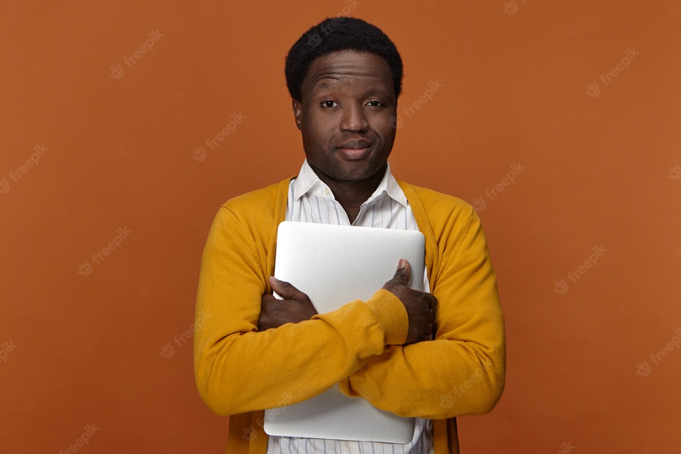 Horizontal Image Successful Confident Handsome Young Afro American Businessman Embracing Portable Computer Having Pleased Satisfied Facial Expressions Smiling Enjoying Electronic Device 343059 1568