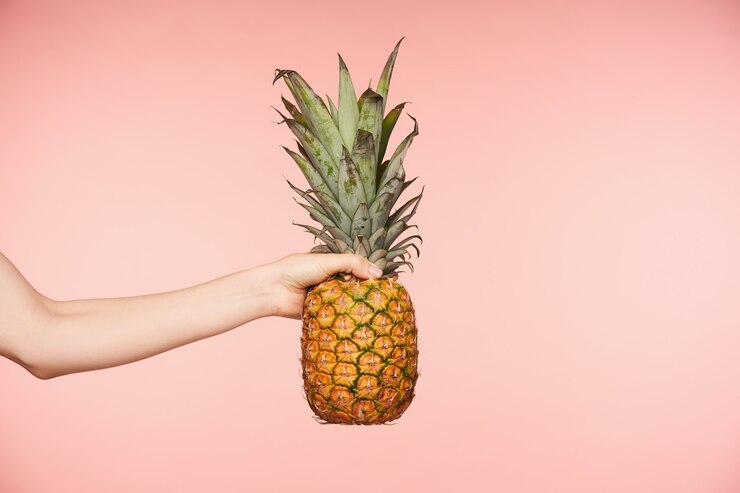 Horizontal Photo Female S Hand Posing Pink Background With Big Pineapple Hold Fingers Tight While Holding It Fresh Fruits Food Concept 295783 11798