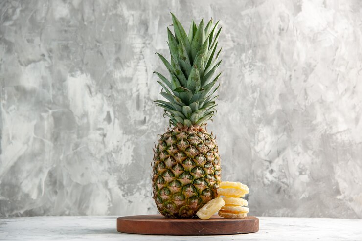 Horizontal View Whole Fresh Golden Pineapple Limes Cutting Board Standing White Table 140725 97104