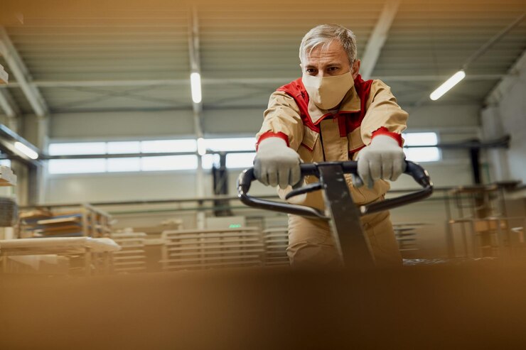 Male Worker With Protective Face Mask Pulling Pallet Jack Carpentry Warehouse 637285 11763