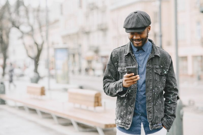 Man in the street. business concept. guy with mobile phone. Free Photo