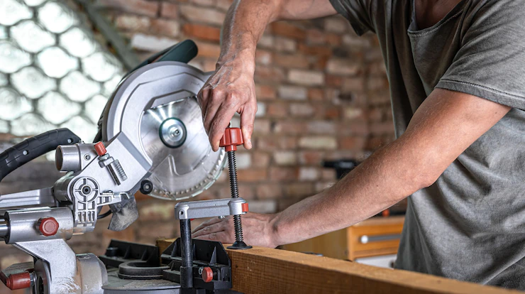 Man With Board Miter Saw Close Up Concept Building Repair 169016 13181