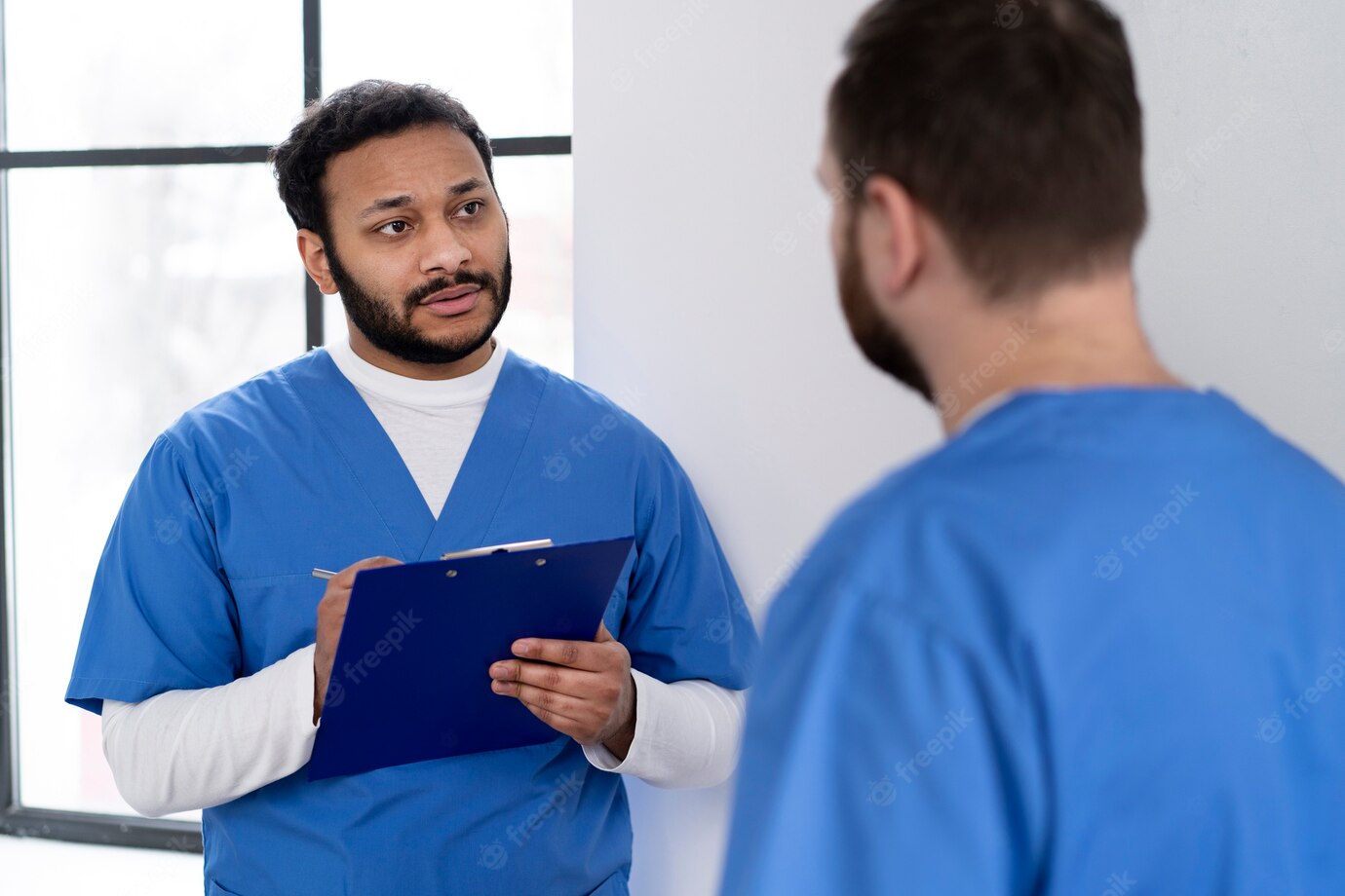 Medium Shot Nurses Discussing Chart 23 2149309988
