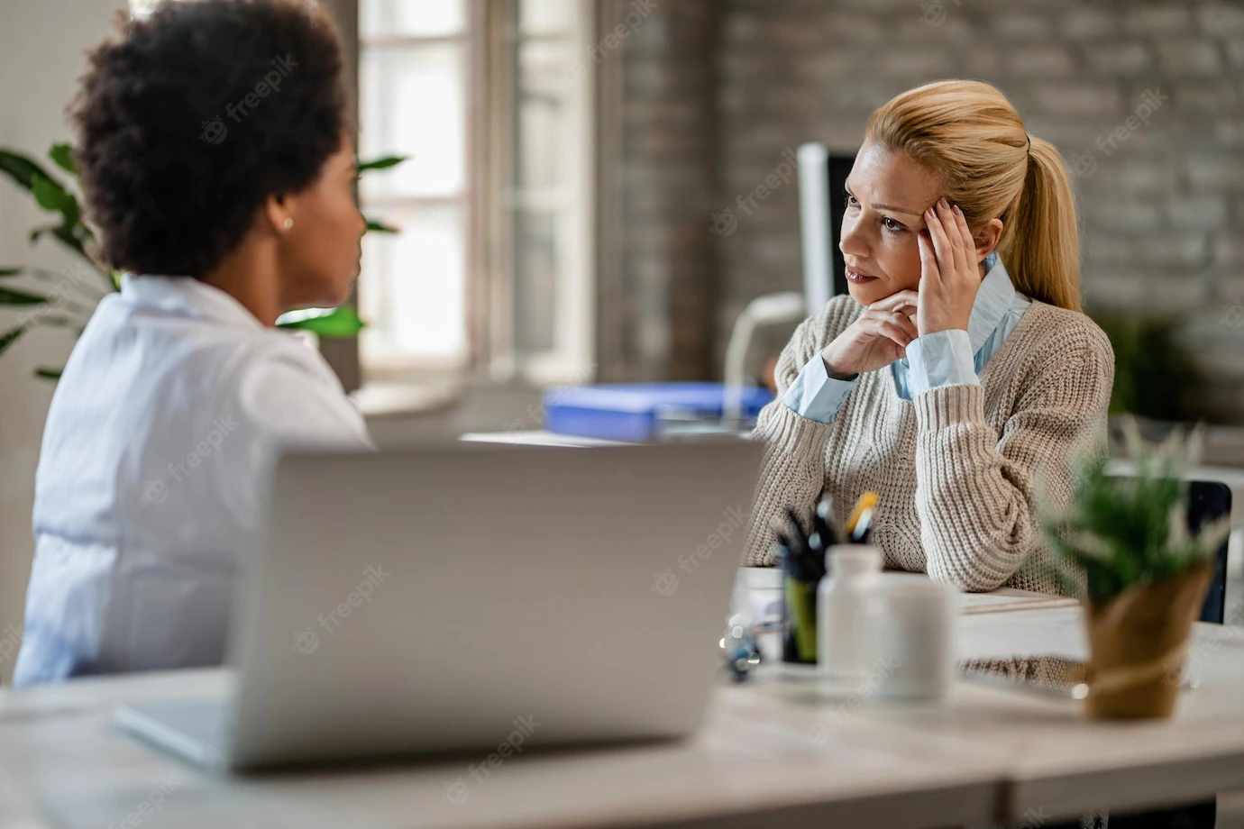 Mid Adult Woman Feeling Worried While Talking African American Doctor During Medical Appointment 637285 1774