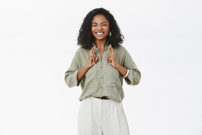 Optimistic hopeful good-looking happy and excited african american young new office worker in trendy outfit Free Photo