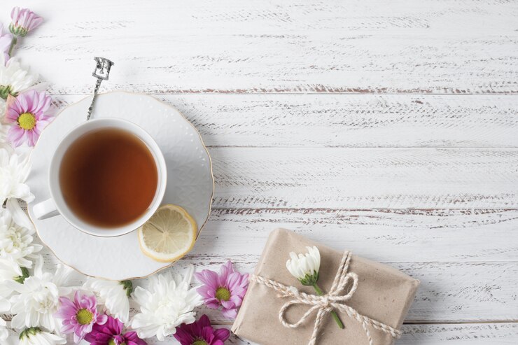 Overhead View Lemon Tea Cup Decorated With Flowers Gift Box Wooden Desk 23 2148091911