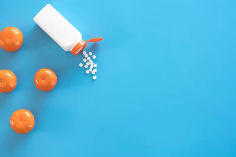 Pills are poured out of a jar on a blue background flat lay Free Photo Pills are poured out of a jar on a blue background flat lay Free Photo