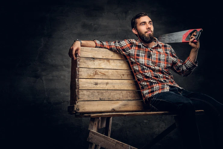 Portrait Bearded Male Dressed Jeans Plaid Shirt Holds Handsaw Shoulder 613910 1048