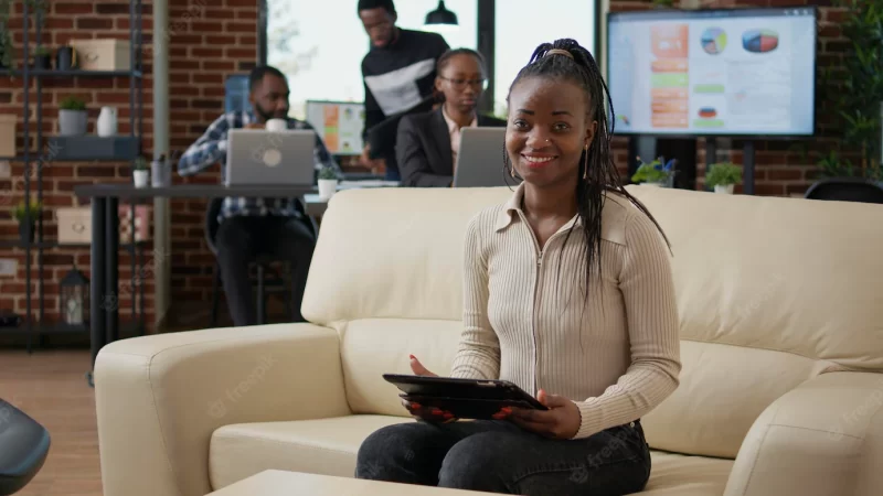 Portrait of businesswoman working on internet with digital tablet, using online statistics to plan marketing analysis. female employee looking at gadget screen to work on presentation. Free Photo