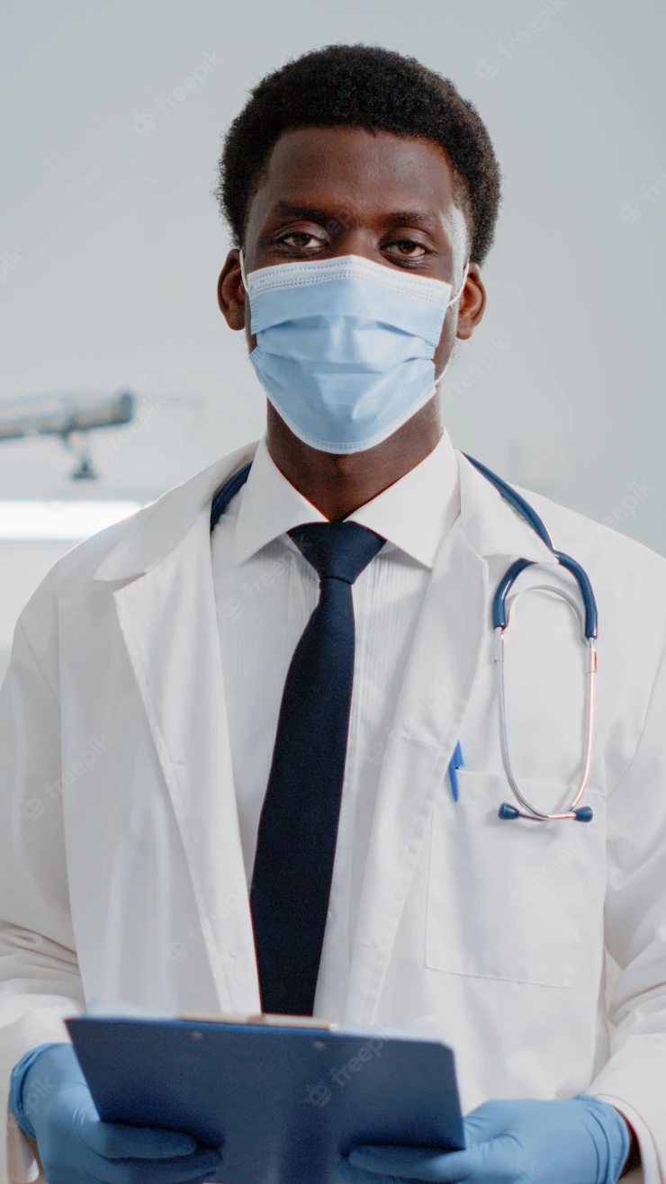 Portrait Man Working As Doctor With Stethoscope Files Standing With Face Mask Hospital Ward General Practitioner With White Coat Checkup Documents During Pandemic 482257 38684