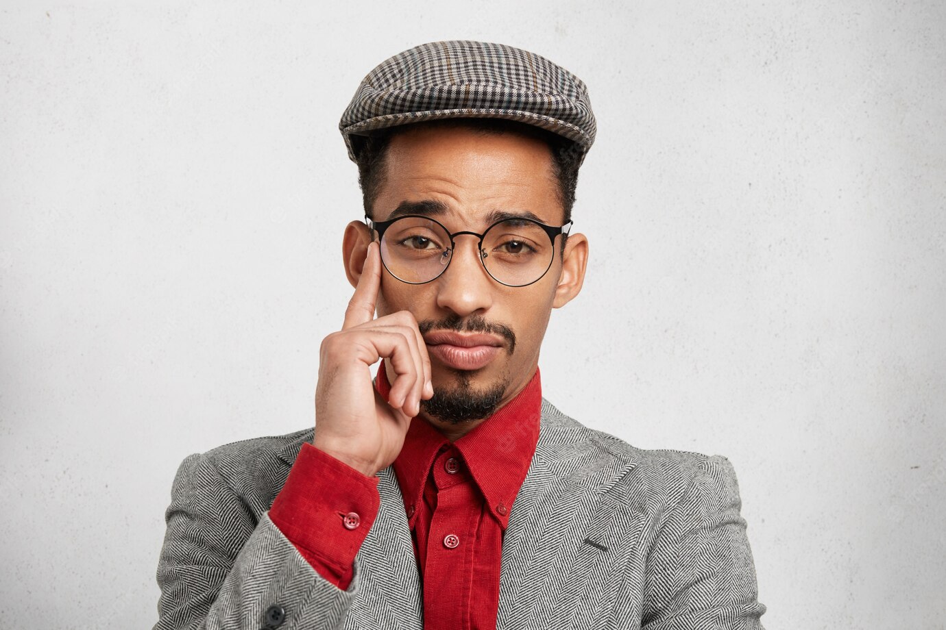 Portrait Thoughtful Pensive Mixed Race Male Employee Wears Trendy Cap Red Shirt Jacket Has Wise Expression 273609 8742