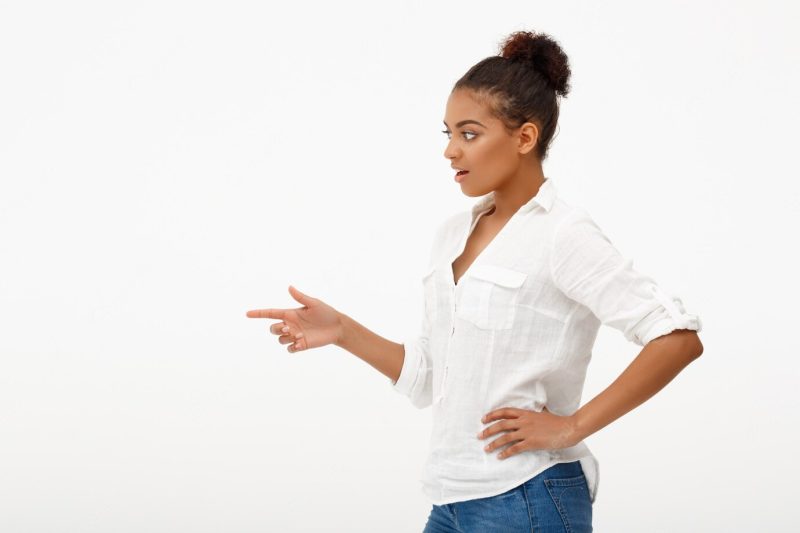 Portrait of young beautiful African girl over white wall Free Photo