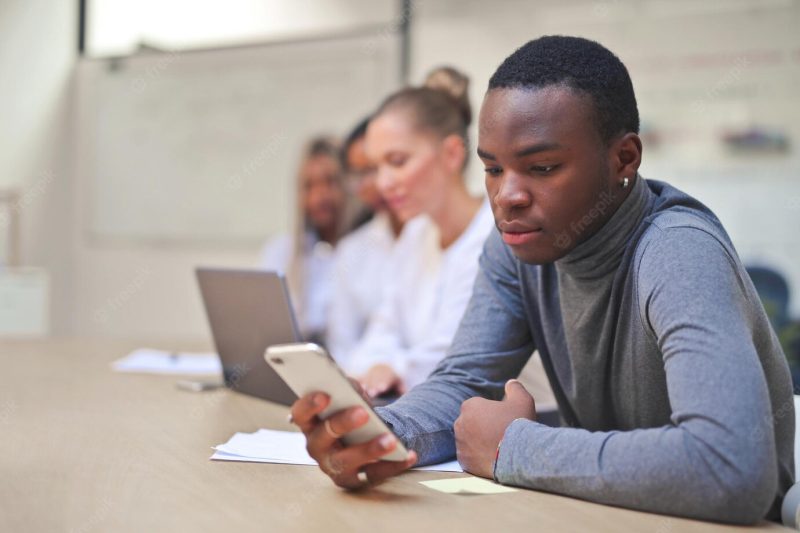 Portrait of young man in office Free Photo