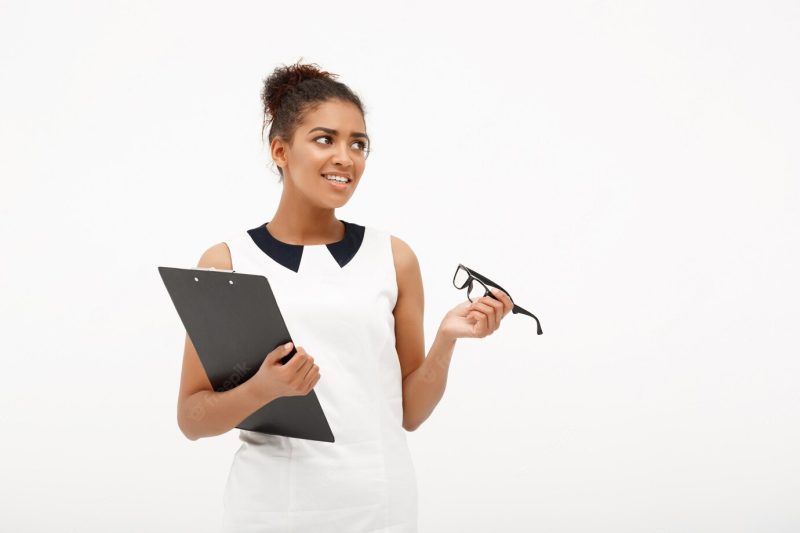 Portrait of young successful African business lady on white Free Photo