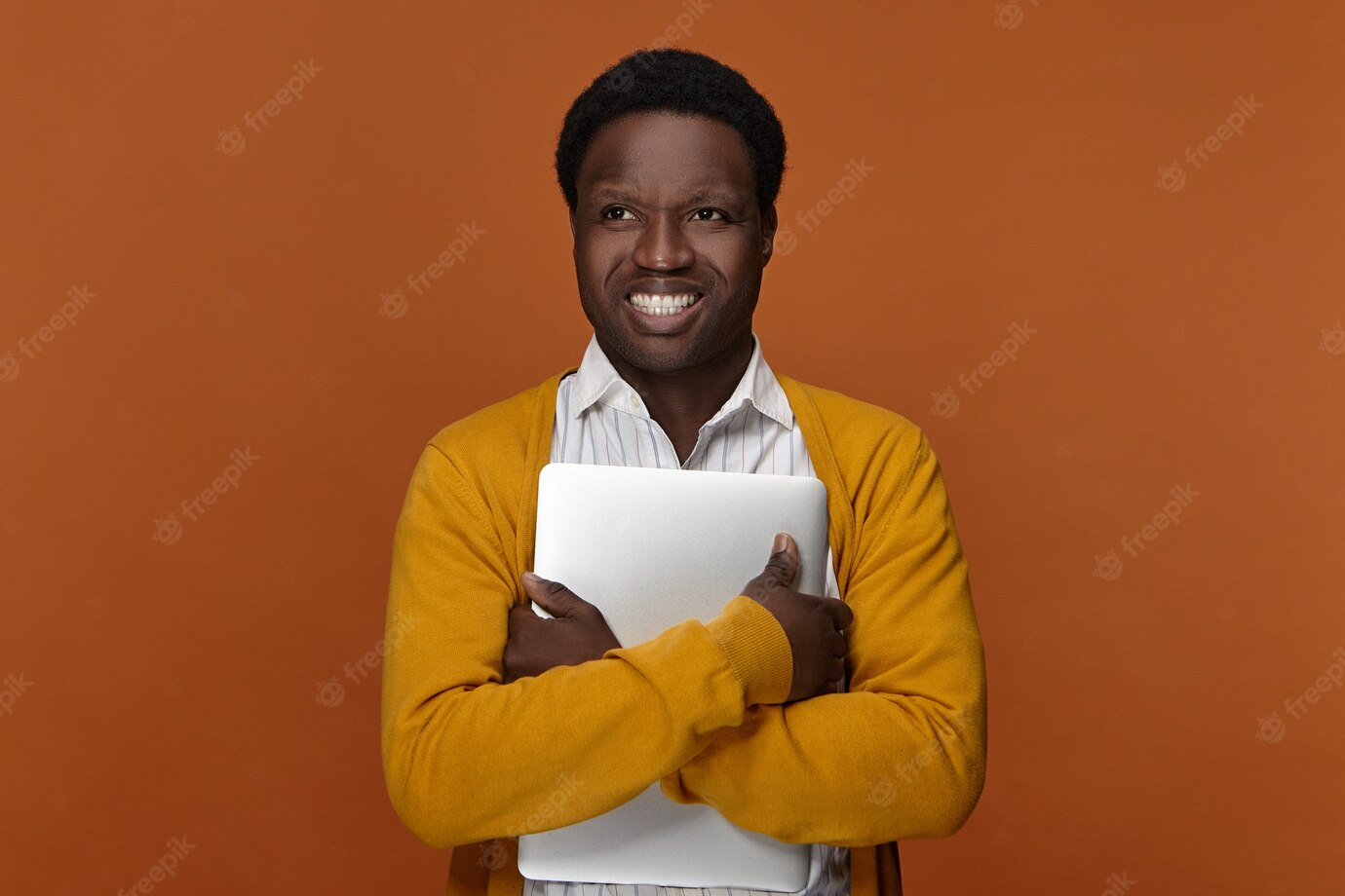 Positive Talented Young Male Freelancer African Appearance Carrying Portable Computer Having Happy Cheerful Facial Expression Smiling Broadly Enjoying His High Speed Electronic Device 343059 1574