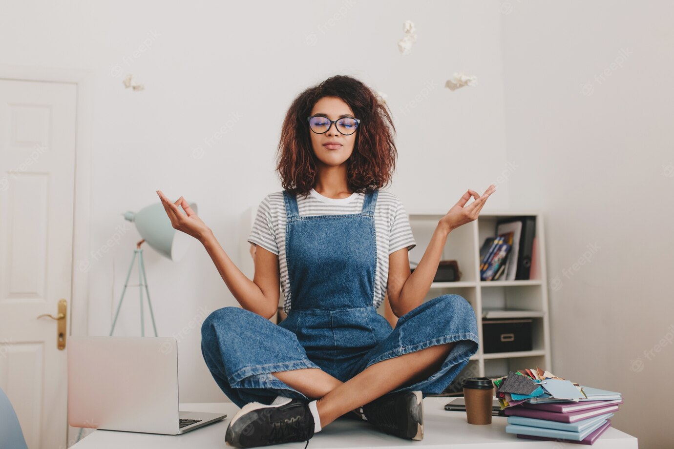 Relaxed Young Woman With Bronze Skin Sitting Lotus Pose Table With Laptop Documents 197531 4913