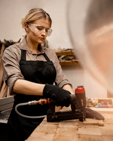 Side View Female Carpenter With Pneumatic Stapler Studio 23 2148813343