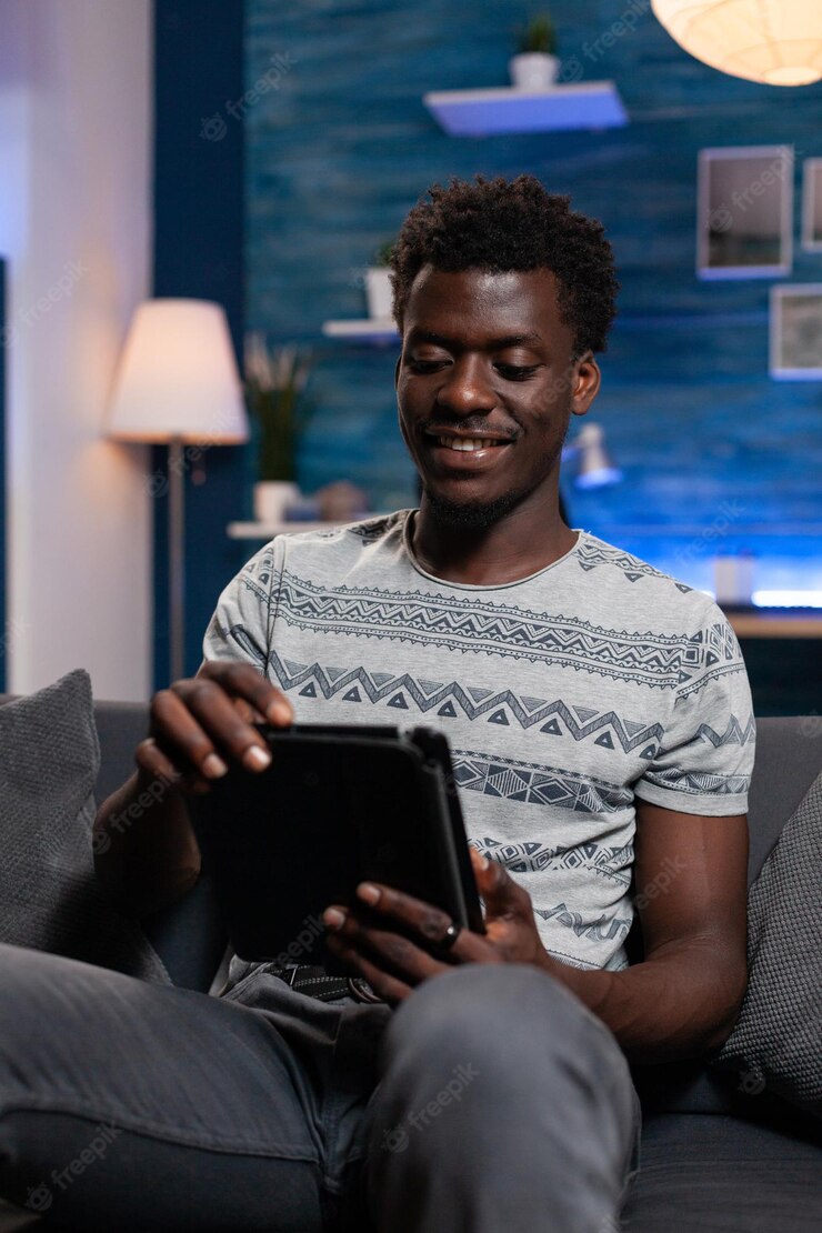 Smiling Guy Holding Tablet Computer Browsing Internet Looking Social Media Enjoying Free Time Home Living Room Freelancer Man Searching Information Online Lesson Remote Work 482257 33967