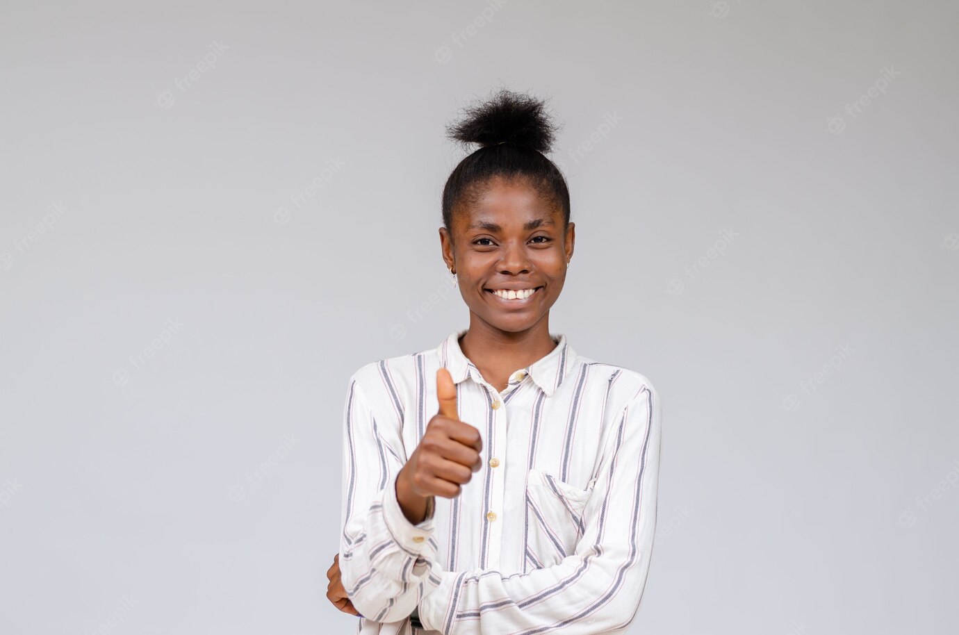 Smiling Nigerian Woman Celebrating Success With Thumbs Up 181624 52041