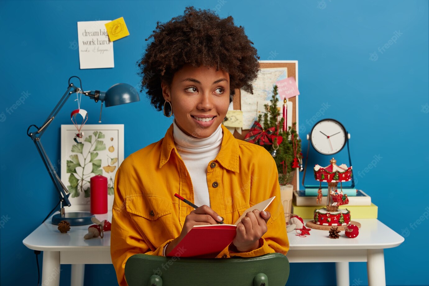 Studying Winter Time Holidays Concept Satisfied Thoughtful Woman With Afro Hair Writes Down Notes Red Notepad Makes List Before Christmas Eve 273609 34015