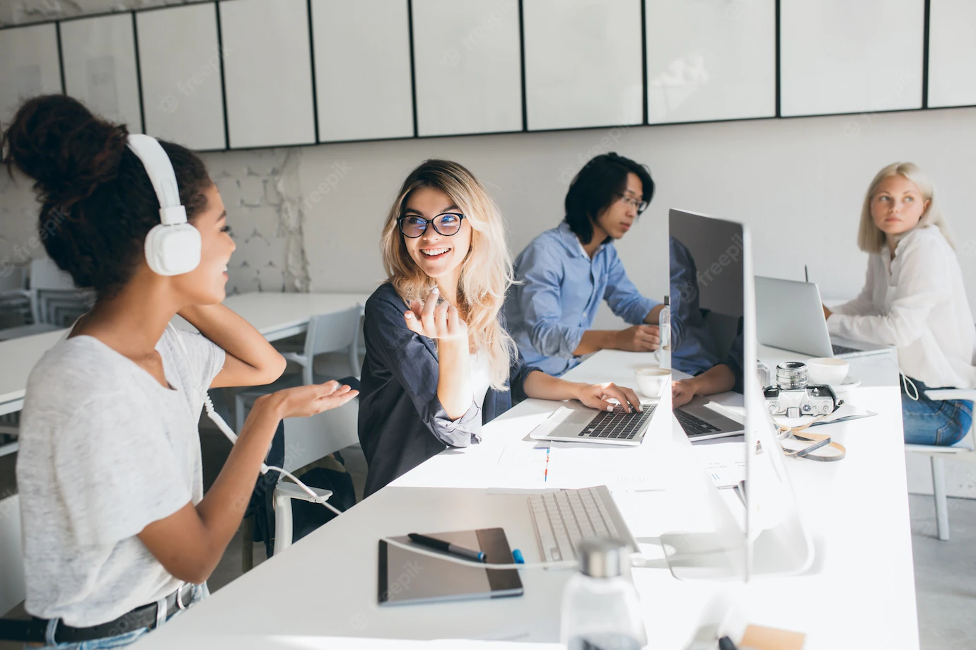 Stylish Female Web Programmers Talking About Work While Spending Time Office Indoor Portrait African Woman Headphones Asian Worker Using Computers 197531 3694