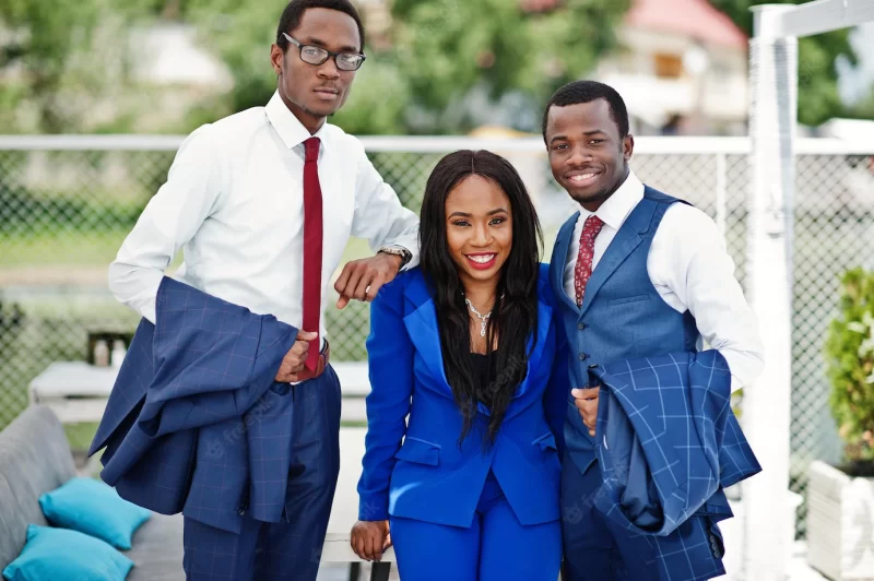 Three african american happy successful people at suit rich black business team Free Photo