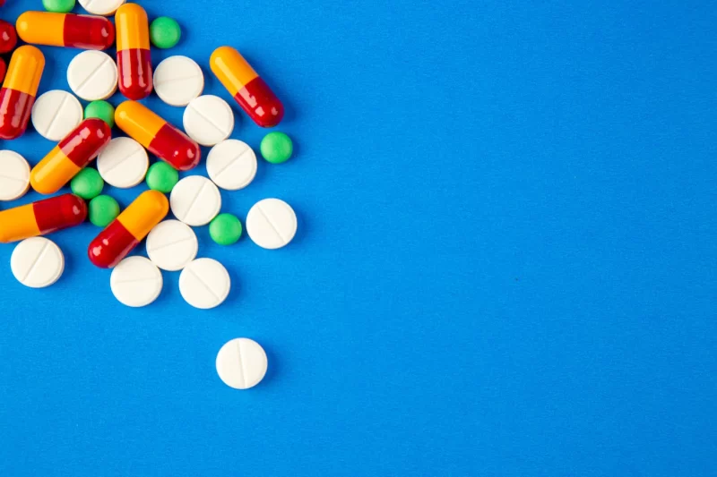 Top view different pills on blue background Free Photo Top view different pills on blue background Free Photo