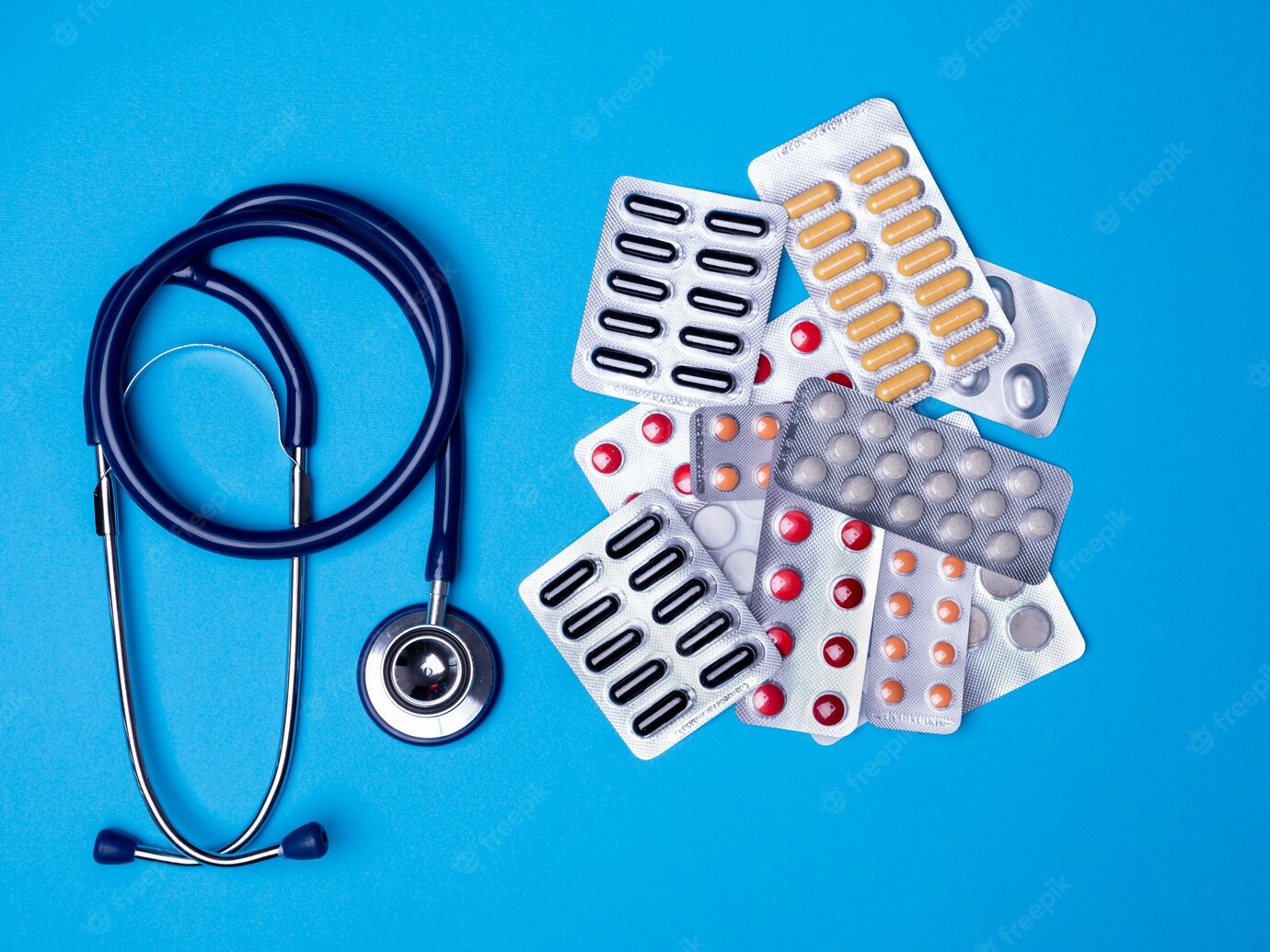 Top View With Stethoscope Blisters With Multicolored Pills Copy Space Blue Background 482257 33013