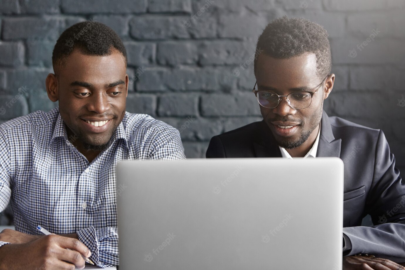 Two Happy African Colleagues Using Laptop 273609 9173