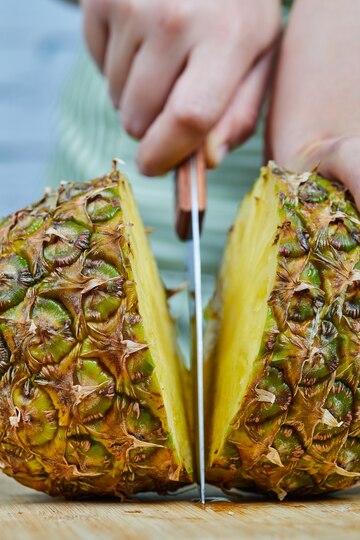 Woman Slicing Fresh Pineapple Wooden Cutting Board Close Up 114579 84500