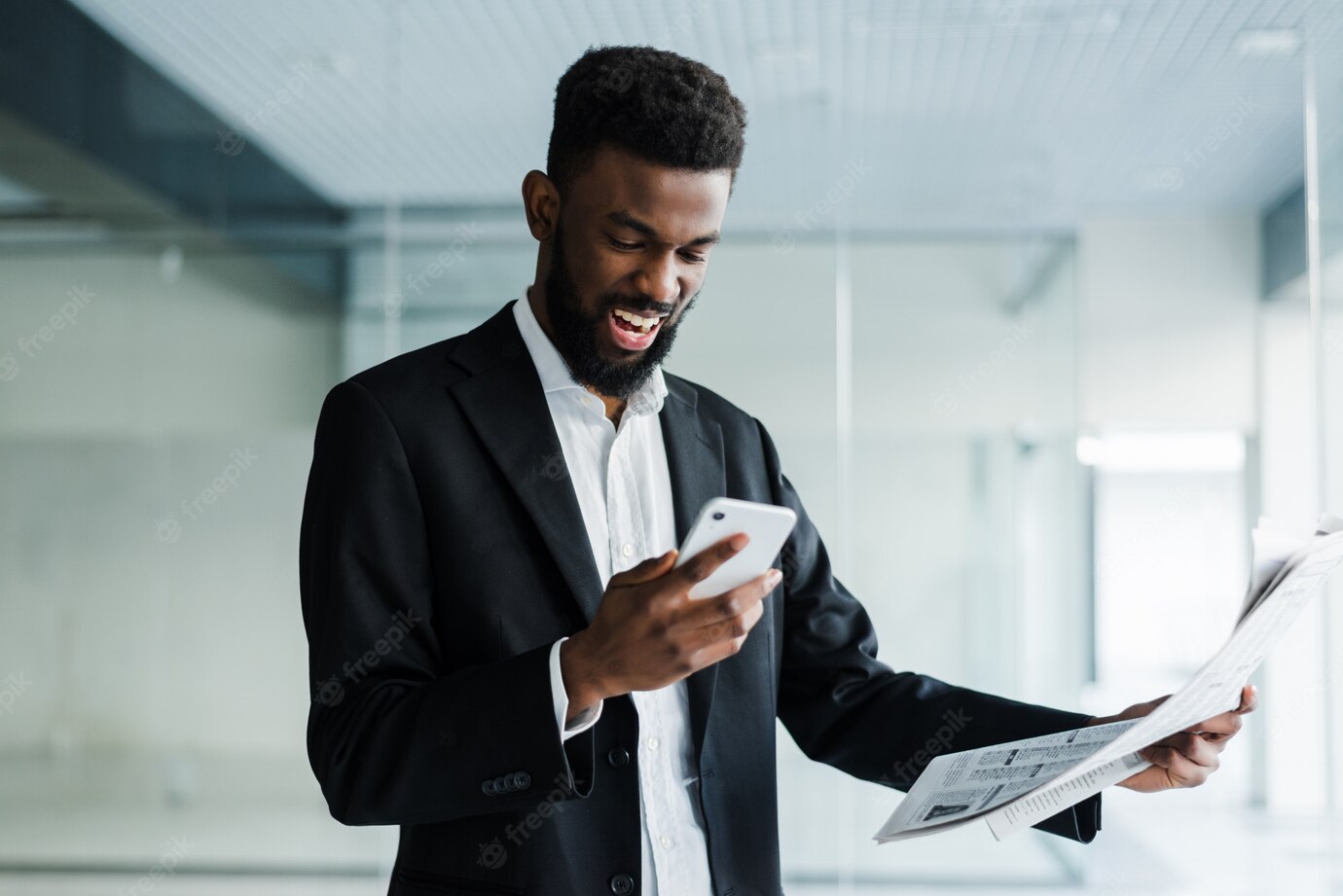 Young African American Businessman Reading Newspaper Talking Phone His Office 231208 771