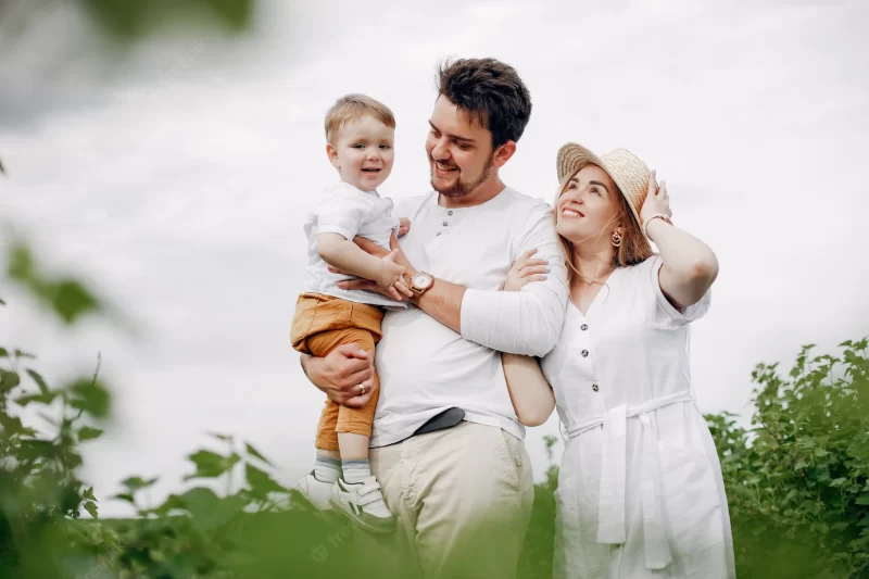 Cute family playing in a summer field Free Photo