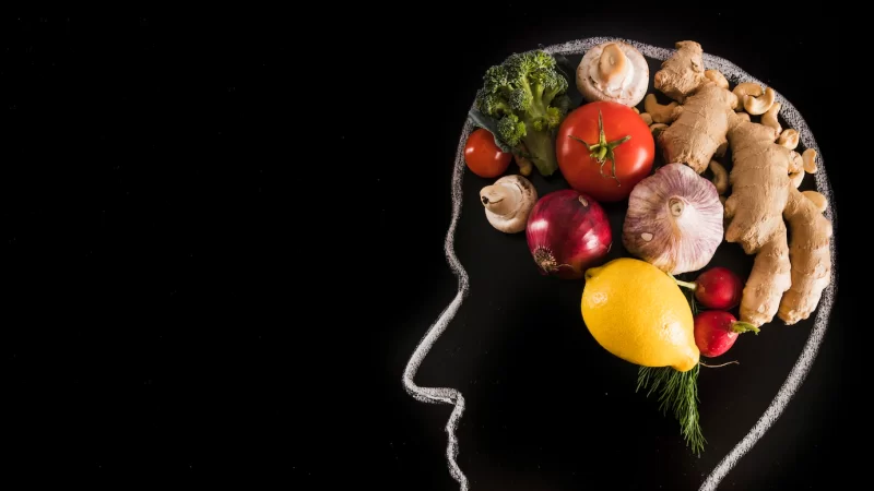 Human brain made with vegetables on blackboard Free Photo