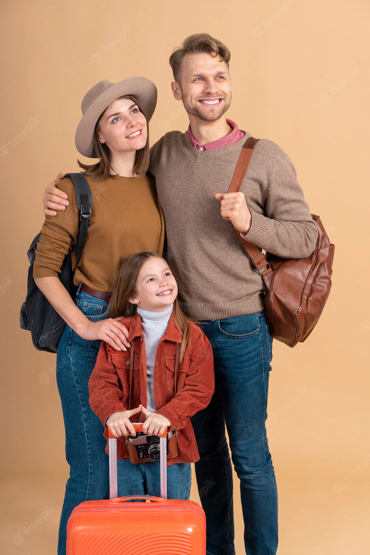 Mother and father with daughter and luggage ready for travel Free Photo